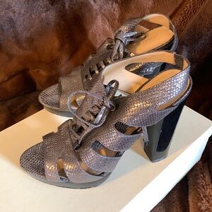 Size 10 metallic platform heels with snake skin, detailing and laces.